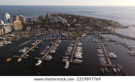 Luxury yacht boats moored at sunset in touristic port of Punta del Este in Uruguay. Aerial view Royalty-Free Stock Photo #2219897769