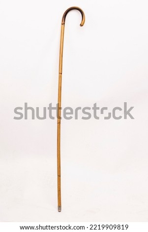 photography of used walking sticks on white background
