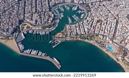 Aerial drone photo of beautiful round harbour and Marina of  Zea or Passalimani in the heart of Piraeus as seen from high altitude, Attica, Greece Royalty-Free Stock Photo #2219913269