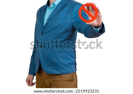 Businessman holds a red NO prohibition symbol