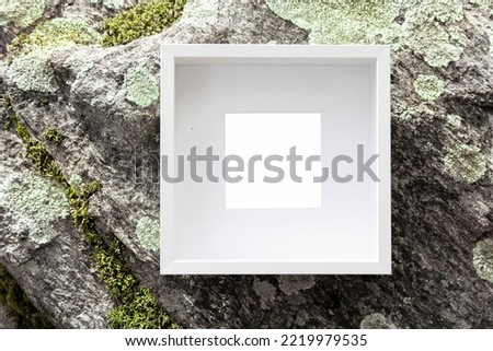Picture frame on rock background. Empty frame with copy space passe partout, natural background, art information, sign concept