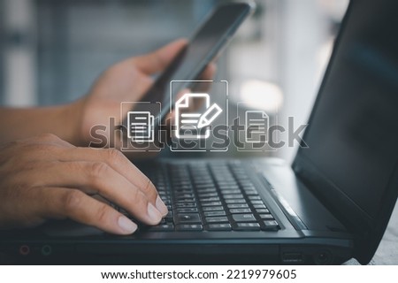 Document Management System (DMS), Businessman use computer laptop for online editing document with virtual screen. Online documentation database and Process automation to efficiently manage files.