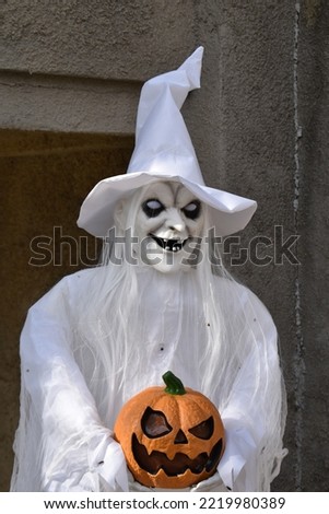 Witch decoration with a pumpkin
