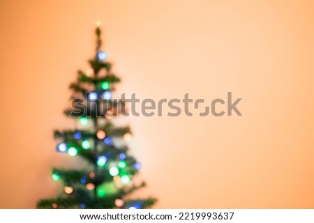 Decorations of Christmas tree, blurry background, visible noise due to high ISO