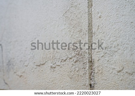 Peeling paint on a concrete wall
