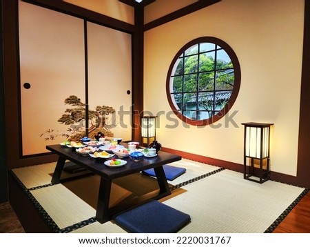 The restaurant has a beautiful dining table.  Japanese style used to decorate the room in Japanese style.  Some blur in the picture