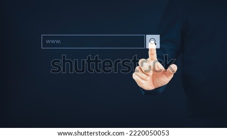 Man hand presses the information search button on computer touch screen. Technology, searching system and internet concept, copy space.