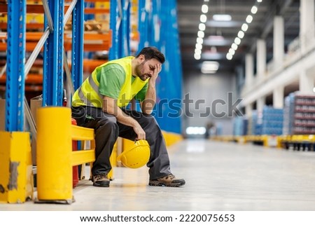 Night shift worker is having headache and migraine on workplace. Royalty-Free Stock Photo #2220075653