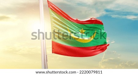 Mauritania national flag waving in beautiful clouds.