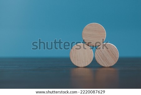 Stacking blank wooden cubes on blue background with copy space for input wording and infographic icon. Empty brown wooden object block for symbol icon put technology, zero gravity, business concept.