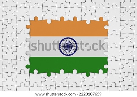 India flag in frame of white puzzle pieces with missing central parts