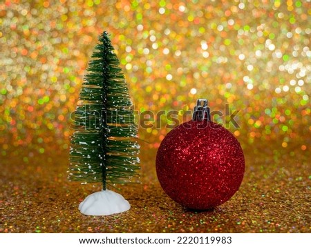 Christmas balls on a golden background. Christmas decoration with beautiful bokeh. Multicolored balls.