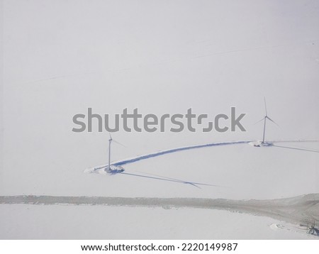 Aerial view of white snow covering city and modern wind turbine in winter, Snowscape wallpaper, city in white, Scandinavia, arctic circle