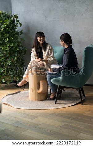 Multi ethnic businesswomen talking meet in modern workspace, Indian female apprentice writing helpful information, listens to middle-aged mentor company boss, coach. Advices, mentoring, interview Royalty-Free Stock Photo #2220172119
