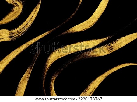This is a background image with gold streamlines drawn with a brush on a black background Royalty-Free Stock Photo #2220173767