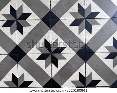 Heritage tiles floral pattern of Penang old building. floor tiles wallpaper concept. selective focus
