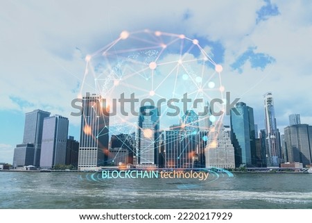 Skyline of New York City Financial Downtown Skyscrapers over East River from park, Dumbo at day time, Manhattan. Decentralized economy. Blockchain, cryptography and cryptocurrency concept, hologram
