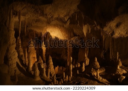 Many stalactite and stalagmite formations inside cave