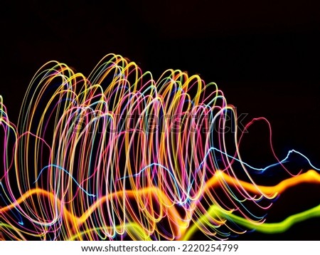 light trails using different colours in isolated background 
