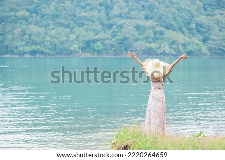 Concept of freedom happy woman  summer photo 
On natural blurred background