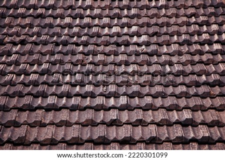 Old brown roof tiles background. Architecture. Vintage Grunge shingle roof Texture