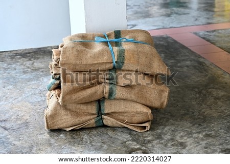 Close up of gunny bag on the floor, selective focus. Royalty-Free Stock Photo #2220314027