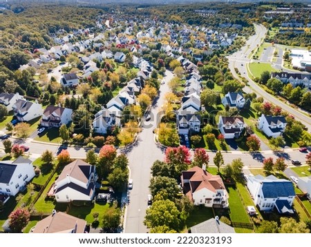 Aerial view of upscale residential area, gated community street real estate with single family homes. Autumn sunny day. Royalty-Free Stock Photo #2220323193