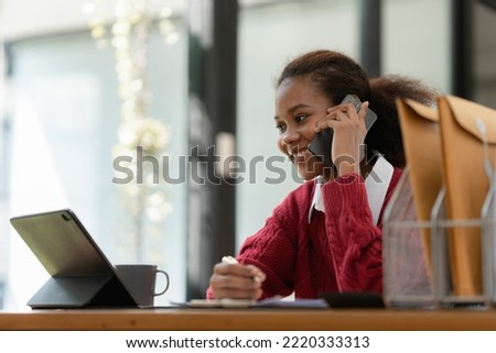 Portrait of Happy black woman talking with friend by cell phone