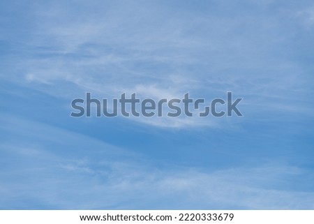 Beautiful white cirrus clouds on blue sky. Natural background. Weather forecast. Copy space for your text and decorations. Beauty in nature theme.