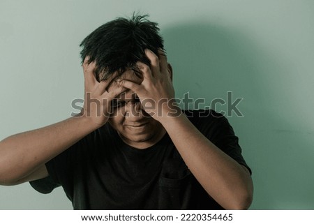 a man who is dizzy and has a headache stress