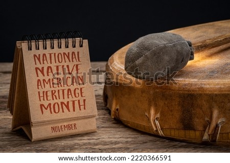 November - National Native American Heritage Month, handwriting in a small desktop calendar with a shaman drum, reminder of historical and cultural event Royalty-Free Stock Photo #2220366591