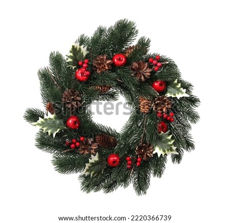
Christmas wreath with holly, ivy, mistletoe, fir and pine cones   isolated on white background.