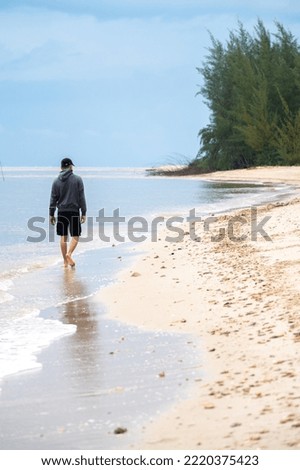 man walking on the beach 