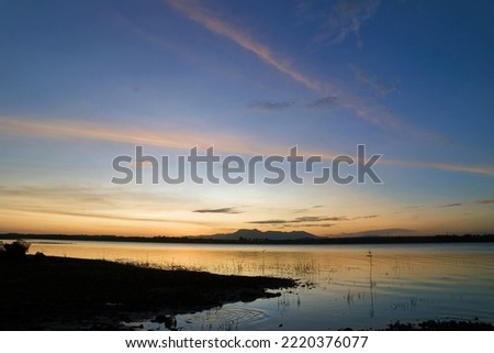 Irregular lake for agriculture under sunset 