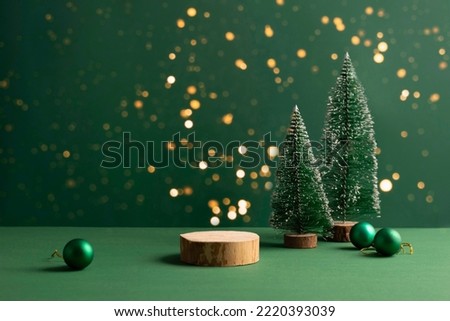 Festive Christmas scene podium for products showcase, promotional sale, minimalist green background Royalty-Free Stock Photo #2220393039