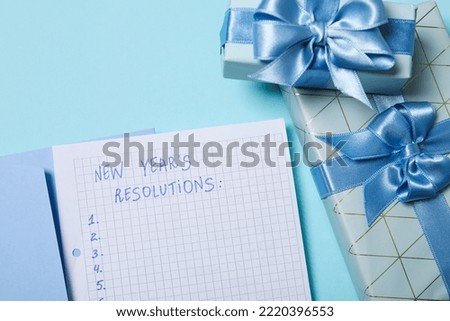 Concept of New Year Resolutions list, new year goals, close up