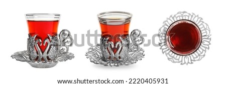 Set with glasses of traditional Turkish tea in vintage holders on white background. Banner design