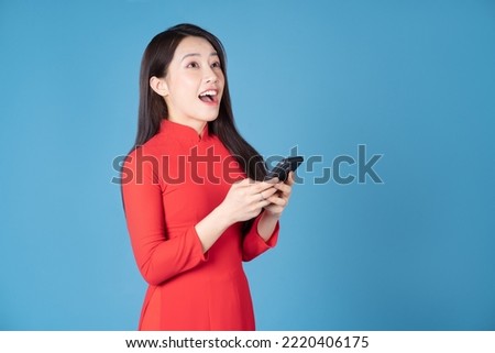Photo of young Vietnamese woman wearing red ao dai Royalty-Free Stock Photo #2220406175