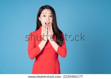 Photo of young Vietnamese woman wearing red ao dai Royalty-Free Stock Photo #2220406177