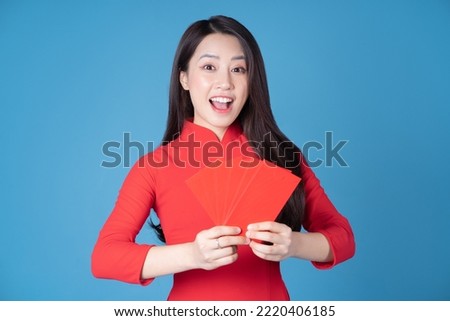 Photo of young Vietnamese woman wearing red ao dai Royalty-Free Stock Photo #2220406185