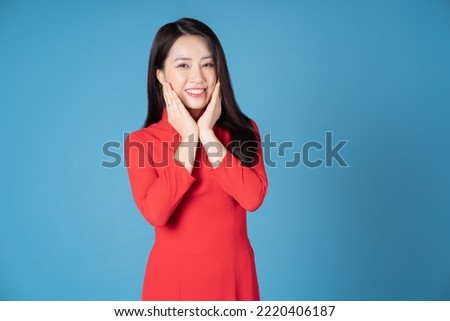 Photo of young Vietnamese woman wearing red ao dai Royalty-Free Stock Photo #2220406187