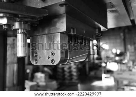 Sheet Metal Stamping Tool Die for Automotive Precision Parts on The Numerical Control Milling Machine Table. Tandem Stamping System. At a High Quality Technology Factory. Black and White Photography. Royalty-Free Stock Photo #2220429997