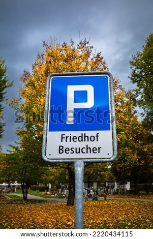 Parking sign in Switzerland with the german inscription. English translation: For visitors to the cemetery