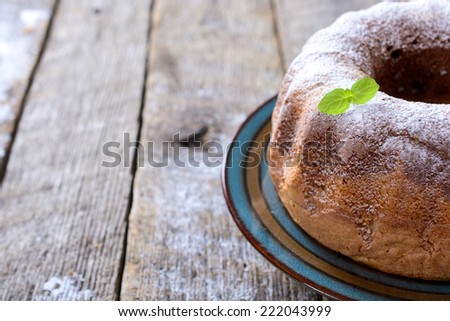 Sweet Marble cake on the wooden background with blank space on left side 