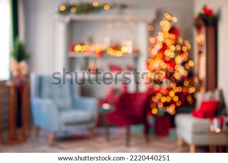 Blured Christmas interior bokeh light background. Copy space for placing items.