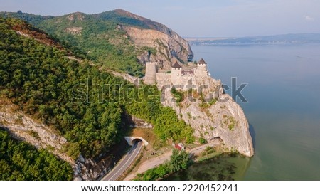 Aerial photography of Golubac medieval fortress located on the Danube river on Serbian bank. Photography was shot from a drone at higher altitude with camera level for a panoramic shot.