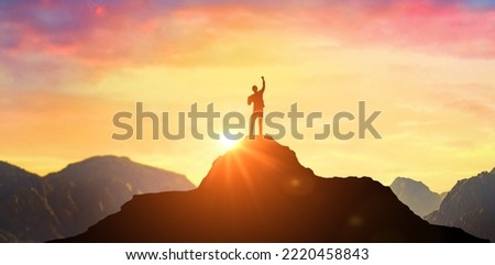 Success Business Leadership, Winner on top. Success. Silhouette man at peak of mountains. Panoramic view on mountains hills Successfully achieving your goal. Successful person has achieving new peak Royalty-Free Stock Photo #2220458843