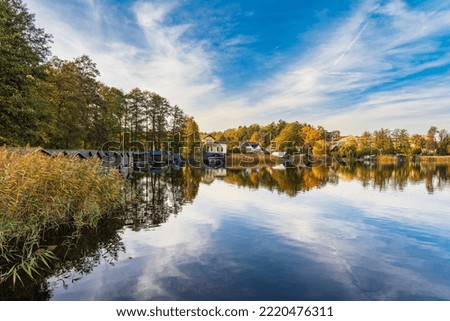 View over the lake Haussee to the city Feldberg, Germany. Royalty-Free Stock Photo #2220476311