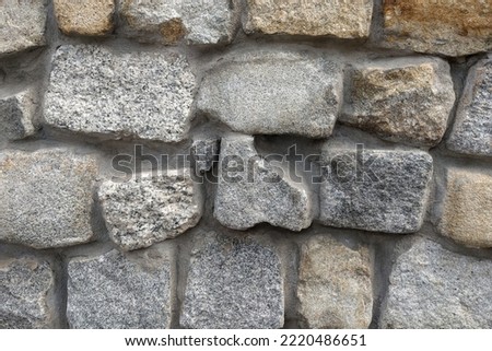 The background of stones in the wall, the texture of the stone