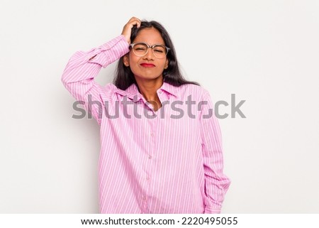 Young Indian woman isolated on white background tired and very sleepy keeping hand on head.
